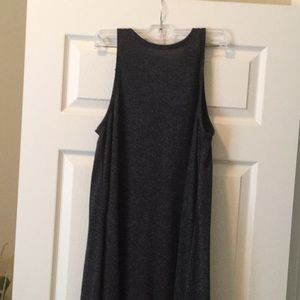 Dark grey, high neck with cut in shoulders.